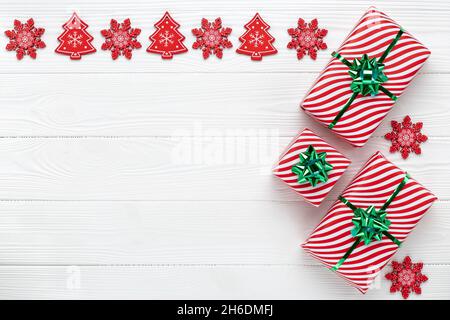 Gifts for the New Year. Christmas frame with decorations. Greeting card with minimal design. Place for text. Pattern with copy space. Flat lay. Festiv Stock Photo