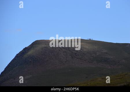 Group of People Walking on the Wainwright 'Red Pike' from the Summit of 'Starling Dodd' in the Lake District National Park, Cumbria, England, UK. Stock Photo