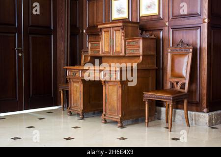 wooden antique secretaire in the house - retro furniture interior Stock Photo