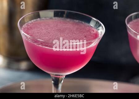 Cold Refreshing Purple Aviation Cocktail with a Cherry Garnish Stock Photo
