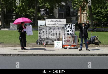 File photo dated: 23/05/06. Peace Activist Brian Haw outside The Houses Of Parliament after police removed most of his anti-war placards at the scene of his five-year vigil in Westminster, London A statement on brianhaw.tv said that Mr Haw had lost his battle with lung cancer yesterday.  Stock Photo