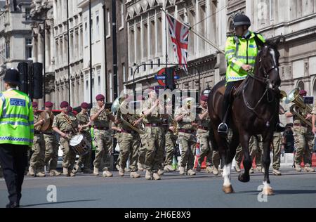 Soldiers from the 16 Air Assault Brigade, march from Wellington Barracks to Carriage Gates at the Palace of Westminster for their homing parade this afternoon. Stock Photo