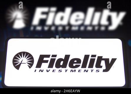 In this photo illustration a Fidelity Investments logo seen displayed on a smartphone screen and in the background. (Photo by Rafael Henrique / SOPA Images/Sipa USA) Stock Photo