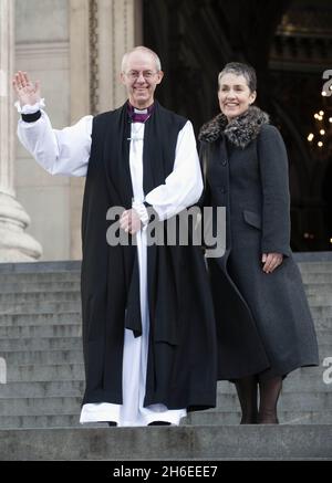 The new Archbishop of Canterbury, Justin Welby, with his wife Caroline, pictured outside St Paul's Cathedral in London  following his ceremony known as the confirmation of election. Stock Photo