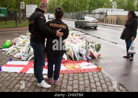 Flowers and tributes are left outside the Royal Artillery Barracks in Woolwich, Southeast London for Drummer Lee Rigby was murdered in a terror attack.  Stock Photo