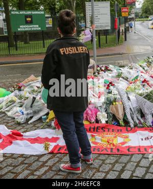 Flowers and tributes are left outside the Royal Artillery Barracks in Woolwich, Southeast London for Drummer Lee Rigby was murdered in a terror attack.  Stock Photo