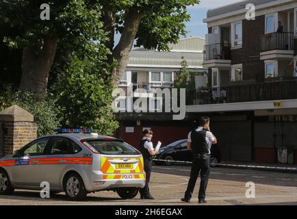 Police maintain a cordon at a crime scene on Spey Street, Poplar, east ...