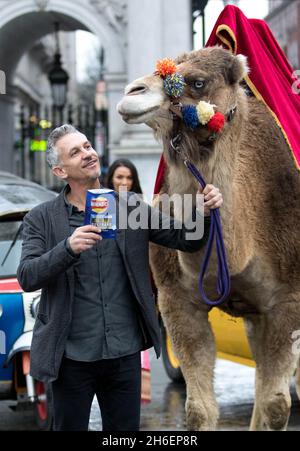 Gary Lineker brings Thailand, Morocco, India and New York to the streets of London to launch Walkers Spell & Go campaign, where people collect letters in packs of crisps to be in with a chance of winning one of 20,000 holidays up for grabs.  Stock Photo