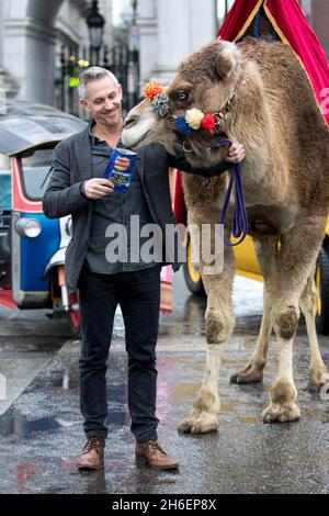 Gary Lineker brings Thailand, Morocco, India and New York to the streets of London to launch Walkers Spell & Go campaign, where people collect letters in packs of crisps to be in with a chance of winning one of 20,000 holidays up for grabs.  Stock Photo