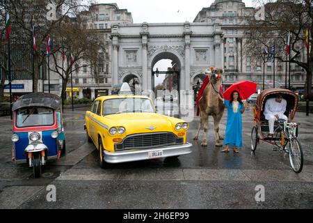 Gary Lineker brings Thailand, Morocco, India and New York to the streets of London to launch Walkers Spell & Go campaign, where people collect letters in packs of crisps to be in with a chance of winning one of 20,000 holidays up for grabs.  Stock Photo