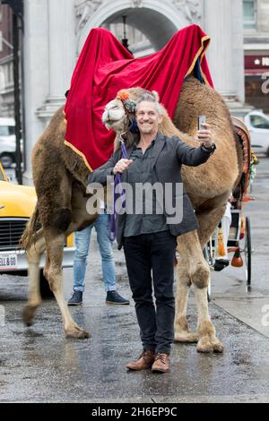 Gary Lineker brings Thailand, Morocco, India and New York to the streets of London to launch Walkers Spell & Go campaign, where people collect letters in packs of crisps to be in with a chance of winning one of 20,000 holidays up for grabs.  Stock Photo