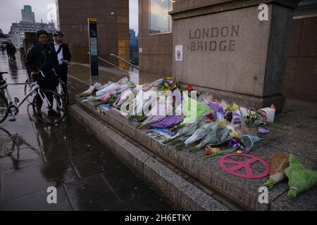 A poster, along with tributes, has been left on London Bridge by friends of a man called Sebastian who has been missing since the terror attack at the weekend. Stock Photo