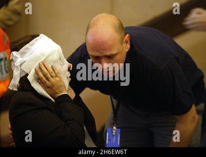 A series of bomb attacks on central London's Transport system killed more than 50 people and injured about over 700 others on 07/07/05. Picture shows : An injured woman at Edgware Road tube station. Jeff Moore/allactiondigital.com              Stock Photo