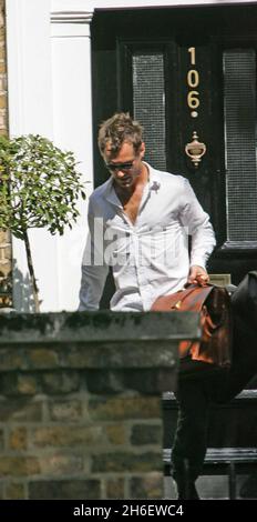 Jude Law leaves the Maida Vale he shares with girlfriend Sienna Miller. The celebrity couple have been reconciled after splitting because Jude had an affair with his childrens nanny. Jeff Moore/allactiondigital.com  Stock Photo