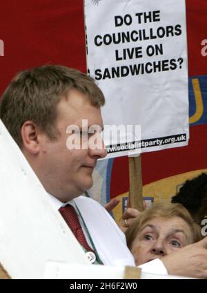 Council leader Clyde Loakes took at dramatic u turn last night and backed down on proposals to scrap school dinners in Waltham Forest after almost 400 protesting school children, parents and dinner ladies refused to moved from the steps of the local chambers in Walthamstow banging pots and pans until he agreed to talk to them. Celebrity chef Jamie Oliver gave his backing to the campaign.  Stock Photo