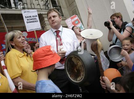 Council leader Clyde Loakes took at dramatic u turn last night and backed down on proposals to scrap school dinners in Waltham Forest after almost 400 protesting school children, parents and dinner ladies refused to moved from the steps of the local chambers in Walthamstow banging pots and pans until he agreed to talk to them. Celebrity chef Jamie Oliver gave his backing to the campaign.  Stock Photo