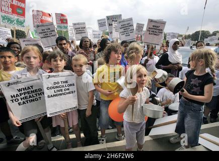 Council leader Clyde Loakes took at dramatic u turn last night and backed down on proposals to scrap school dinners in Waltham Forest after almost 400 protesting school children, parents and dinner ladies refused to moved from the steps of the local chambers in Walthamstow banging pots and pans until he agreed to talk to them. Celebrity chef Jamie Oliver gave his backing to the campaign.  Stock Photo