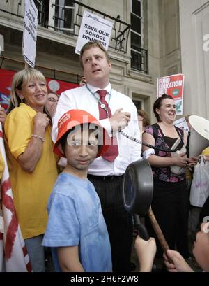 Council leader Clyde Loakes took at dramatic u turn last night and backed down on proposals to scrap school dinners in Waltham Forest after almost 400 protesting school children, parents and dinner ladies refused to moved from the steps of the local chambers in Walthamstow banging pots and pans until he agreed to talk to them. Celebrity chef Jamie Oliver gave his backing to the campaign.  Stock Photo