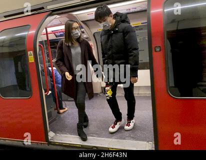 Commuters wearing face masks on the London Uderground.  Stock Photo