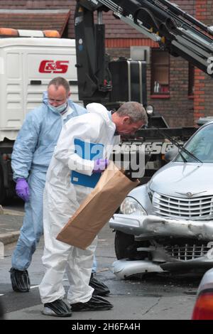 Investigations get underway at the scene close to the Olympic site in Stratford, East London, where a police officer sustanined serious head injuries following an incident involving burglary suspects Stock Photo