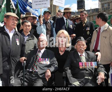 Joanna Lumley joined veteran Gurkha soldiers outside the Houses Of Parliament in London today to protest against their right to stay in the UK. Some 36,000 former Gurkhas have been denied residency because they served in the British army before 1997. Stock Photo