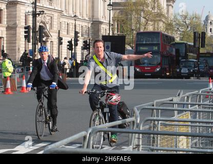 File photo dated 22/04/2009 of David Cameron riding to the Commons on his bike. The Conservative Party leader David Cameron has had his bicycle stolen again. The bike, a silver and black Scott commuter cycle, is believed to have been stolen from outside his London home this morning. This is the second time Cameron has had a bike stolen. The first time was in last July when it was snatched from outside a supermarket. Stock Photo