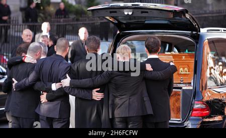 Band members including Ronan Keating stand by the coffin of Stephen Gately outside the Church of St Laurence O'Toole in Dublin after the funeral of the Boyzone singer who died of natural causes last weekend aged 33. Stock Photo