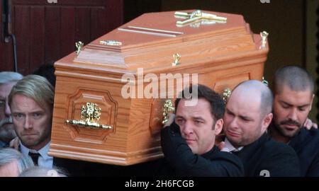 Band members including Ronan Keating carry the coffin of Stephen Gately from the Church of St Laurence O'Toole in Dublin after the funeral of the Boyzone singer who died of natural cause last weekend aged 33. Stock Photo