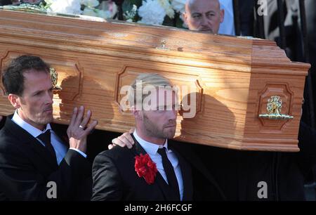 Band members including Ronan Keating carry the coffin of Stephen Gately outside the Church of St Laurence O'Toole in Dublin after the funeral of the Boyzone singer who died of natural causes last weekend aged 33. Stock Photo