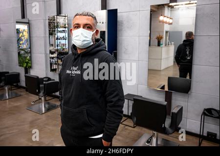 Berlin, Germany. 15th Nov, 2021. Tarik Duraktekin, hairdresser, stands in his hairdressing salon. In the capital, the 2G rule applies with further restrictions for the unvaccinated. (to dpa 'Tightened Corona rules - criticism of controls') Credit: Fabian Sommer/dpa/Alamy Live News Stock Photo