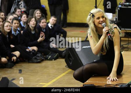 Singer Pixie Lott performs at her old School, Brentwood County High School in Essex, for the Department for Children, Schools and Families campaign Tune In - Year of Music. Stock Photo