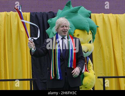 The Mayor of London Boris Johnson welcomes the start of the Fifa World Cup alongside Zakumi the Official Mascot of the 2010 World Cup with local children in Trafalgar Square, London Stock Photo