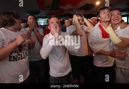 England football fans watch the gamel at The Sports Cafe in London's Haymarket this afternoon Stock Photo