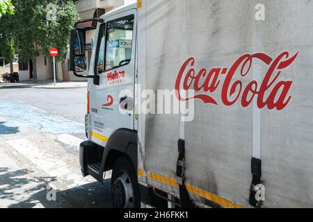PLASENCIA, SPAIN - May 11, 2021: Plasencia, Spain - May 11, 2021: White Coca Cola soft drink truck Coke brand logistic deliver soft drinks and product Stock Photo