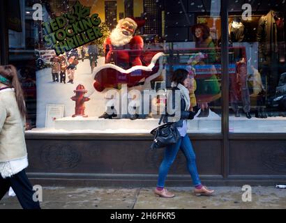 A saucy Santa forms part of a Ted Baker window display in London. The scene includes a moving Father Christmas who lifts his tunic to reveal stockings and suspenders. A similar display in the Cambridge branch of Ted Baker has already received complaints. With one customer branded it as 'sick'. Stock Photo
