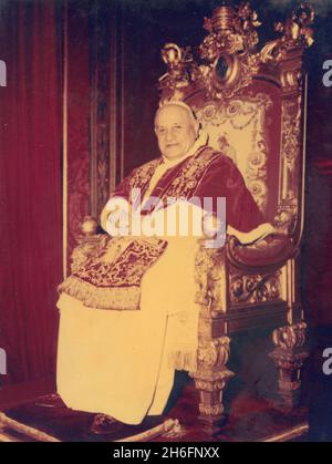 Pope John XXIII sitting on the papal chair, Vatican City 1960s Stock Photo