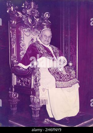 Pope John XXIII sitting on the papal chair, Vatican City 1960s Stock Photo
