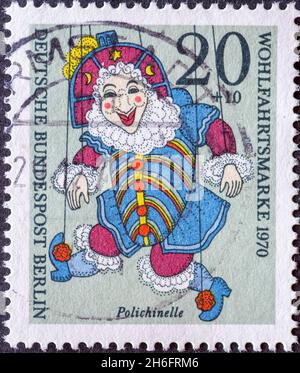 GERMANY, Berlin - CIRCA 1970: a postage stamp from Germany, Berlin showing a charity postal stamp from 1970 with historical puppet. Here: Polichinelle Stock Photo