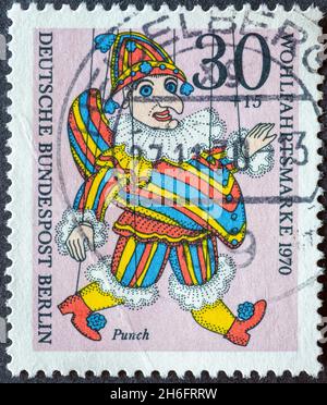 GERMANY, Berlin - CIRCA 1970: a postage stamp from Germany, Berlin showing a charity postal stamp from 1970 with historical puppet. Here: Punch Stock Photo