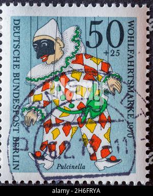GERMANY, Berlin - CIRCA 1970: a postage stamp from Germany, Berlin showing a charity postal stamp from 1970 with historical puppet. Here: Pulchinella Stock Photo