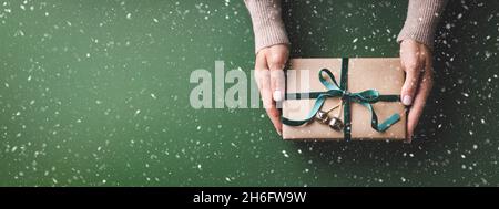 Top view of emerald green ribbon on dark wood background. Liver cancer  awareness concept Stock Photo - Alamy