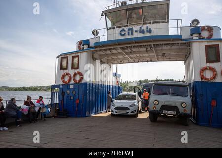 Tutaev, Yaroslavl region, Russia - May 15, 2019: Ferry crossing the Volga river. Cars and passengers on the deck of the SP-44 ferry are transported to Stock Photo