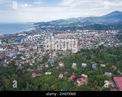 Drone view of the port, sea, city, private houses from the side of the mountain in Batumi. Stock Photo