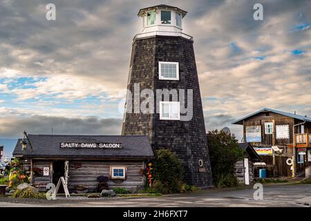 Homer Spit, Alaska, USA - August 07, 2018: The famous Homer Spit lighthouse and pub Salty Dawg Salon Stock Photo