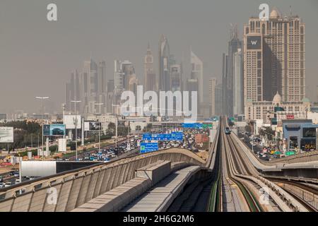 DUBAI, UAE - MARCH 12, 2017: Sheikh Zayed road and tracks of an elevated stretch of Dubai metro, United Arab Emirates Stock Photo