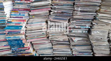 used magazines and books stacked on top of each other Stock Photo