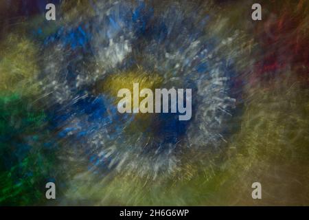 Bursting  colors, abstract of metallic  patterns, lines of blues, yellows, reds, golds, green was created by zooming & twisting camera. Color fusion. Stock Photo