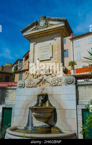 Fountain with monument in the old town of Grimaud - France, Departement Var, Côte d‘Azur Stock Photo