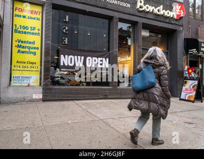 A sign outside of a the Bonchon restaurant in Chelsea in New York on Thursday, November 11, 2021 announces that the restaurant has reopened. (© Richard B. Levine) Stock Photo