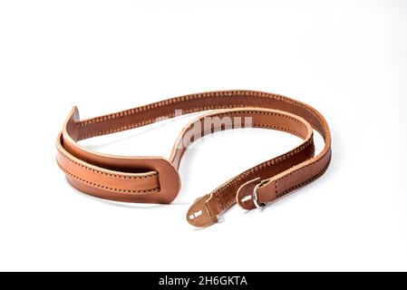 Brown leather camera strap isolated on white background. Isolated with clipping path included Stock Photo